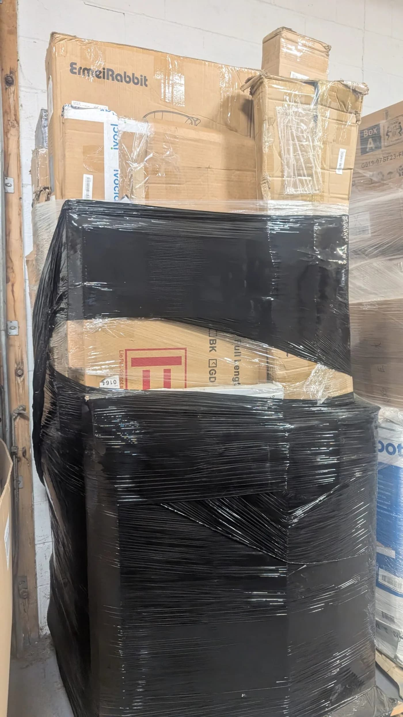 Stacked Undelivered Mail Parcel Pallet — full lot photo